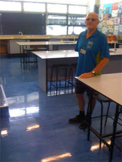 Athol Vogt with his lovely polished floors at Kingsway School