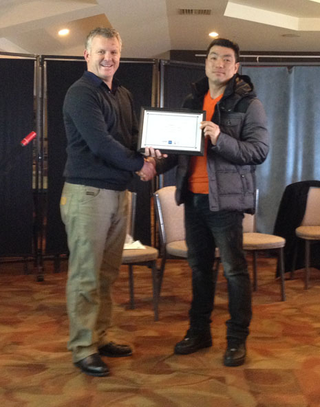 Grant McLauchlan awards Michael Choi for 5 years with CrestClean. 