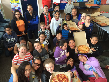 The cleanest kids at St Claudine School with their pizza lunch prize from CrestClean.