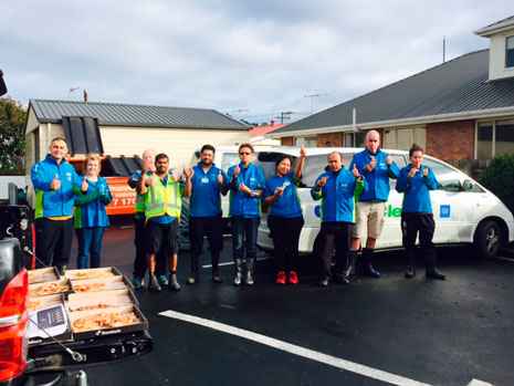 CrestClean Dunedin franchisees enjoyed pizza after they finished cleaning up the kitchen at Radius Fulton Resthome, which was evacuated as a result of flooding.