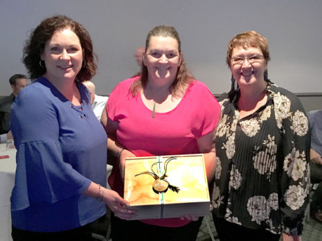 Susan Impey, Opotiki College Principal, receives her gift box prize from CrestClean’s Caroline Wedding and Rachael Hanna.