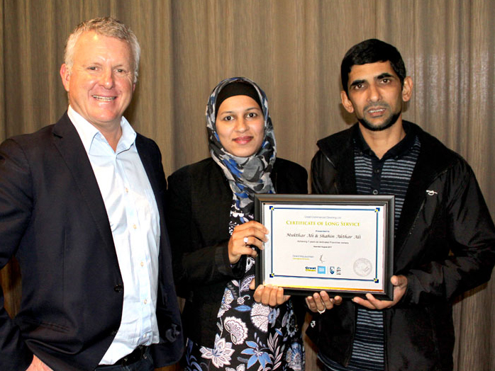 Mukthar Ali and Shahin Akthar Ali receive their seven-year long service award.