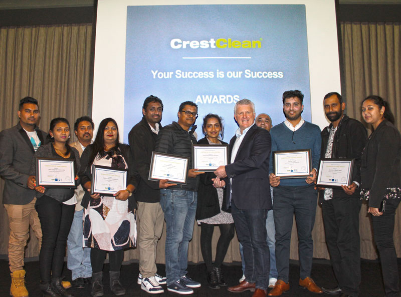 Three-year long service recipients receive their certificates from Grant McLauchlan, CrestClean’s managing director the Auckland Team Meeting.