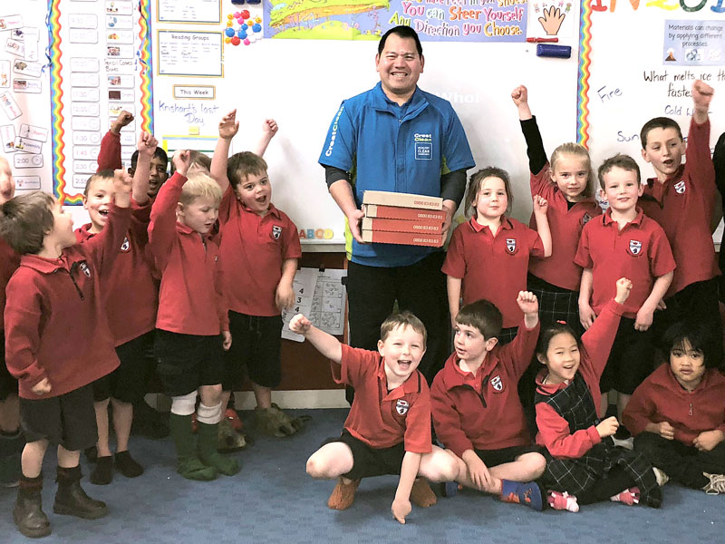 Room 2 (Master Guard Room) at Ashburton Borough School were the lucky winners of Crest’s Cleanest Classroom Award. Handing out the pizza is CrestClean business owner Cicero Calzada.