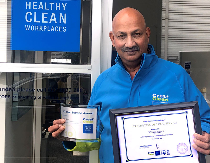 Vijay Nand is proud to receive his long service award.