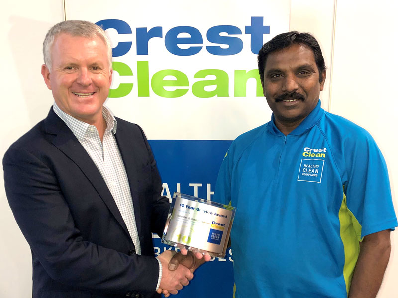 Jay Gounder receives his long service award from Grant McLauchlan, CrestClean’s Managing Director.