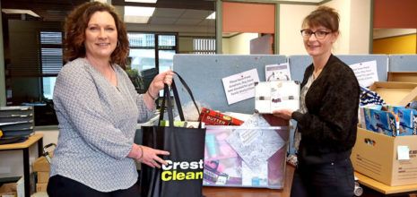 Rachael Hanna hands over the presents to Jasmin Enright of Presbyterian Support Otago.