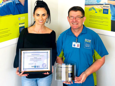 Vince Fisk receives his long service award from, Nicky Kramers, Regional Manager CrestClean Dunedin.