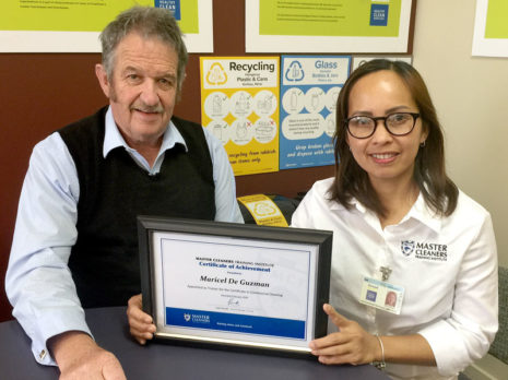 Maricel DeGuzman receives her Certificate of Achievement from CrestClean’s Invercargill Regional Manager Glenn Cockroft.