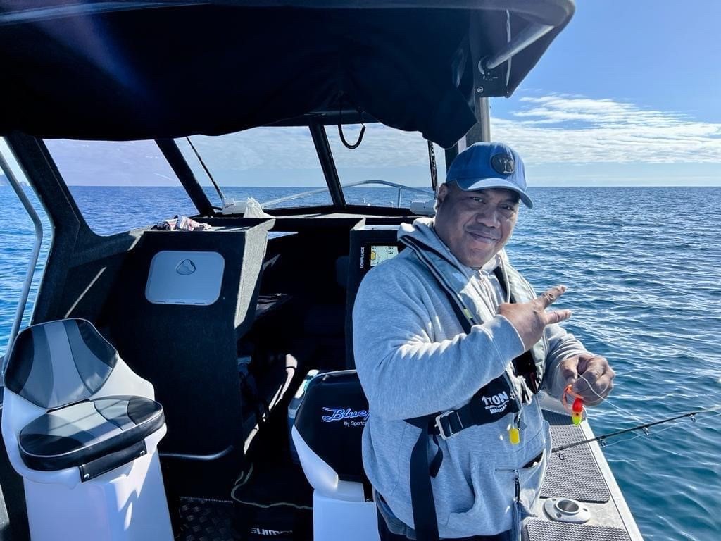 Bura Takinoa enjoys another day out fishing on his boat, Island Blue.