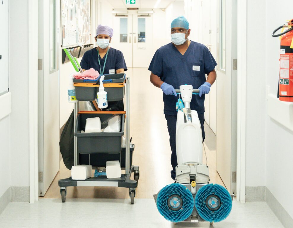 CrestClean teams enter a hospital with fresh cleaning equipment.