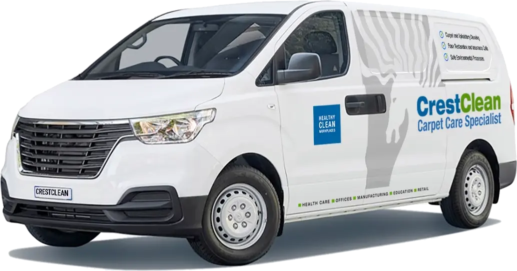 White CrestClean van displaying Carpet Care Specialist branding, parked and ready for commercial cleaning services.